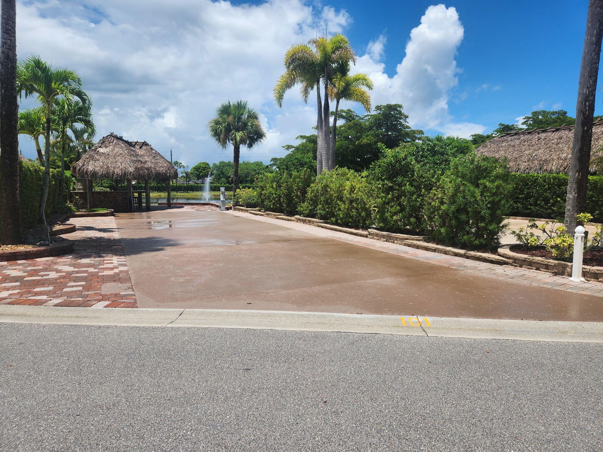 Well appointed back in lot with Tiki on the natural pond. Soak in the views of nature right off the rear view of your tiki! Granite counters, stainless storage and drawers. Barstool seating for entertaining! Painted cement pad with paver trim. Mature landscaping adds to privacy! 18 hole golf on site and is included with your dues. Amenities galore, such as pools, tennis, pickleball, dog parks, exercise, hot tubs and so much more round out this well price piece of paradise located t the Motorcoach Resort at St Lucie West - Class A units only.