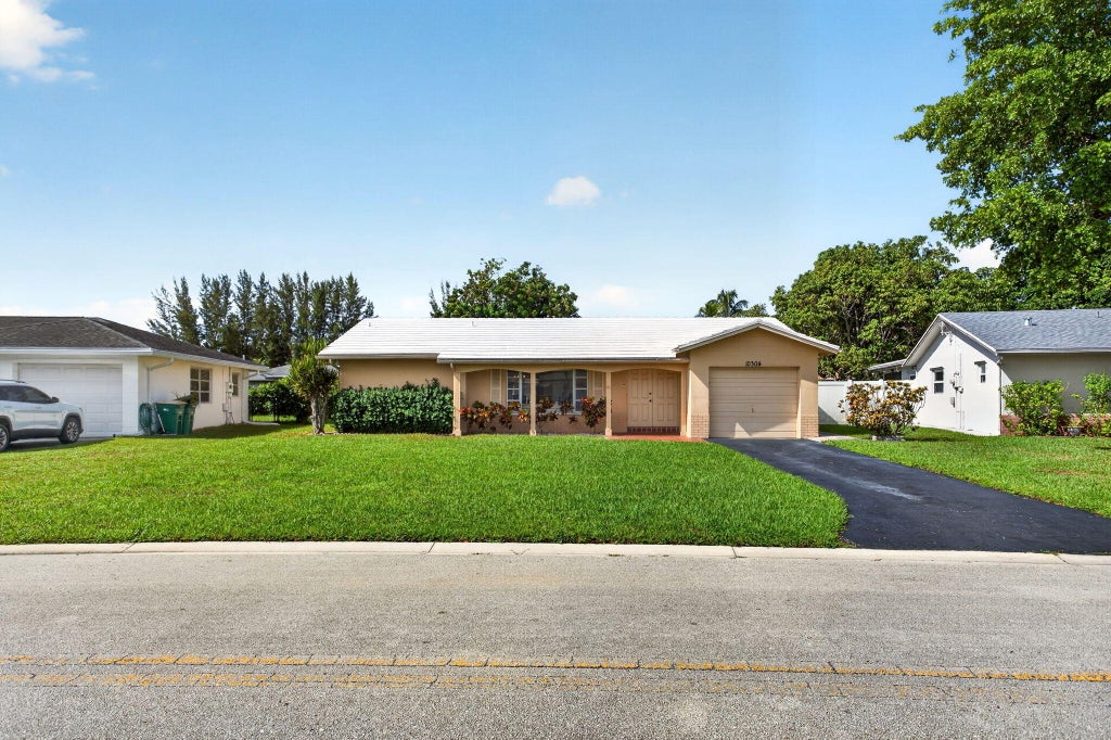 Photo of 10304 NW 80th Drive, Tamarac, FL 33321 (MLS # B26071930)