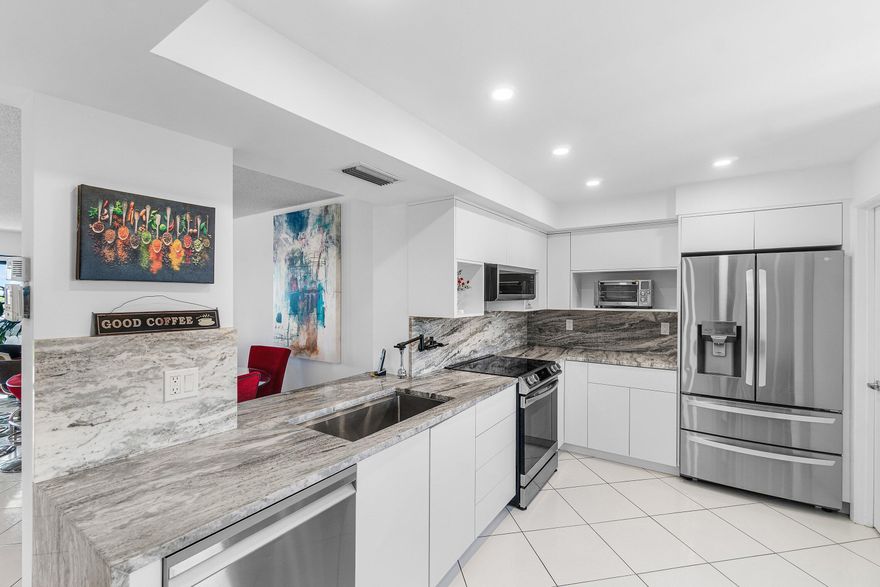 Welcome to the pinnacle of luxury living in the highly sought-after Towers at Huntington Lakes. This rarely available corner penthouse unit is one of the largest floor plans in the building, offering breathtaking panoramic lake views from every room and an abundance of natural light throughout.  Step inside to find an immaculate interior featuring white tile flooring throughout, a renovated kitchen with an inviting eat-in area, and a beautifully updated primary bathroom. The spacious split-bedroom layout provides privacy and functionality, while the den easily converts into a third bedroom or home office—perfect for today's lifestyle. One of the standout features is the expansive 27-foot enclosed terrace, ideal for relaxing or entertaining while enjoying serene water views year-round. Additional conveniences include a separate laundry room and covered parking just steps from the front entrance.  Residents enjoy full access to the Huntington Lakes clubhouse, offering resort-style amenities including a 600+ seat theater, fitness center with classes, tennis, pickleball, indoor and outdoor pools, spa-like facilities, and a newly renovated club room.  Perfectly located within walking distance to shopping, dining, and houses of worship, and just minutes from vibrant downtown Delray Beach, pristine beaches, Delray Marketplace, and endless entertainment options.  This is South Florida living at its finest—don't miss the opportunity to call this exceptional penthouse home.