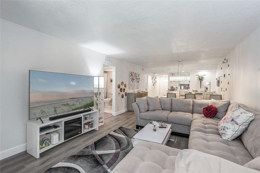 BEAUTIFULLY UPDATED 2BR/2BA bright corner apartment. Enjoy sunsets overlooking Par 3, lush, 11th green. Wide Open Kitchen features high ceiling, glass tile backsplash and large snack bar. Fully & very nicely furnished. 100% vinyl plank flooring throughout. 2 updated showers. 3 TV's. Recreation Lease PAID IN FULL.  Amenities include Restaurant, Billiard Room, Bbq/Picnic Area, Clubhouse, Courtesy Bus, Exercise Room, Heated Pool, Library, Putting Green, Sauna, Shuffleboard, Tennis, Pickle Ball, Vehicle Wash Area, Electric Car Charging Station. Close to shopping, dining & highways. 15 min. to the beach. COMFORTABLE AND TURNKEY! ALL YOU NEED IS YOUR TOOTHBRUSH! (NEW ONE TO BE​​‌​​​​‌​‌​​​‌‌​​​‌‌‌​​‌​​‌‌​​​​ PROVIDED)