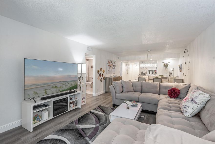 BEAUTIFULLY UPDATED 2BR/2BA bright corner apartment. Enjoy sunsets overlooking Par 3, lush, 11th green. Wide Open Kitchen features high ceiling, glass tile backsplash and large snack bar. Fully & very nicely furnished. 100% vinyl plank flooring throughout. 2 updated showers. 3 TV's. Recreation Lease PAID IN FULL.  Amenities include Restaurant, Billiard Room, Bbq/Picnic Area, Clubhouse, Courtesy Bus, Exercise Room, Heated Pool, Library, Putting Green, Sauna, Shuffleboard, Tennis, Pickle Ball, Vehicle Wash Area, Electric Car Charging Station. Close to shopping, dining & highways. 15 min. to the beach. COMFORTABLE AND TURNKEY! ALL YOU NEED IS YOUR TOOTHBRUSH! (NEW ONE TO BE PROVIDED)