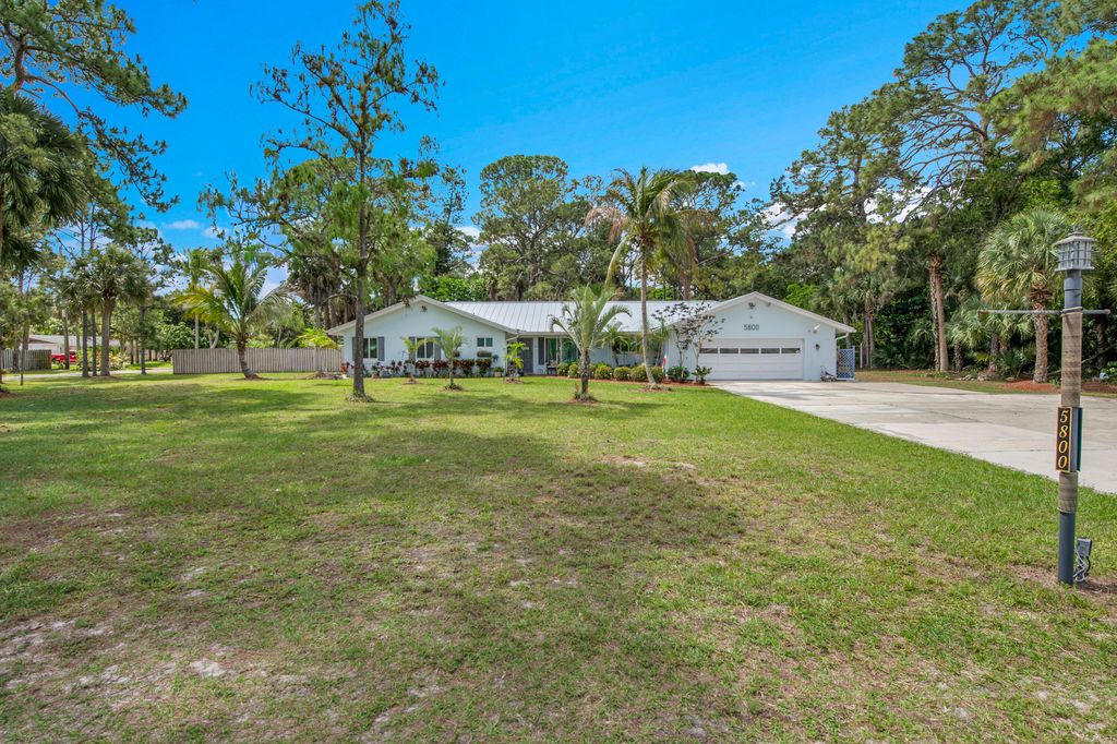 Photo of 5800 Gun Club Road, West Palm Beach, FL 33415 (MLS # B26019183)