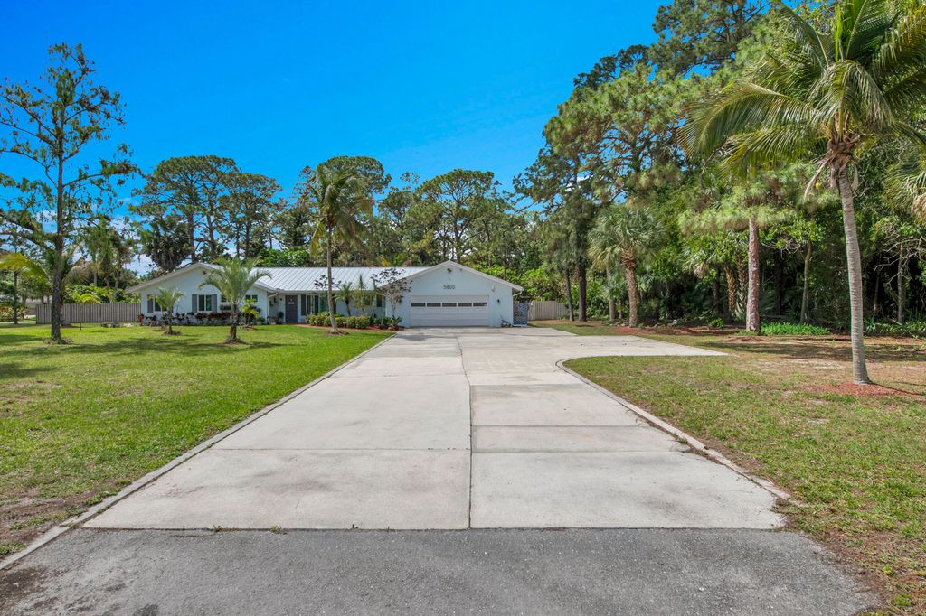 Photo of 5800 Gun Club Road, West Palm Beach, FL 33415 (MLS # B26019183)