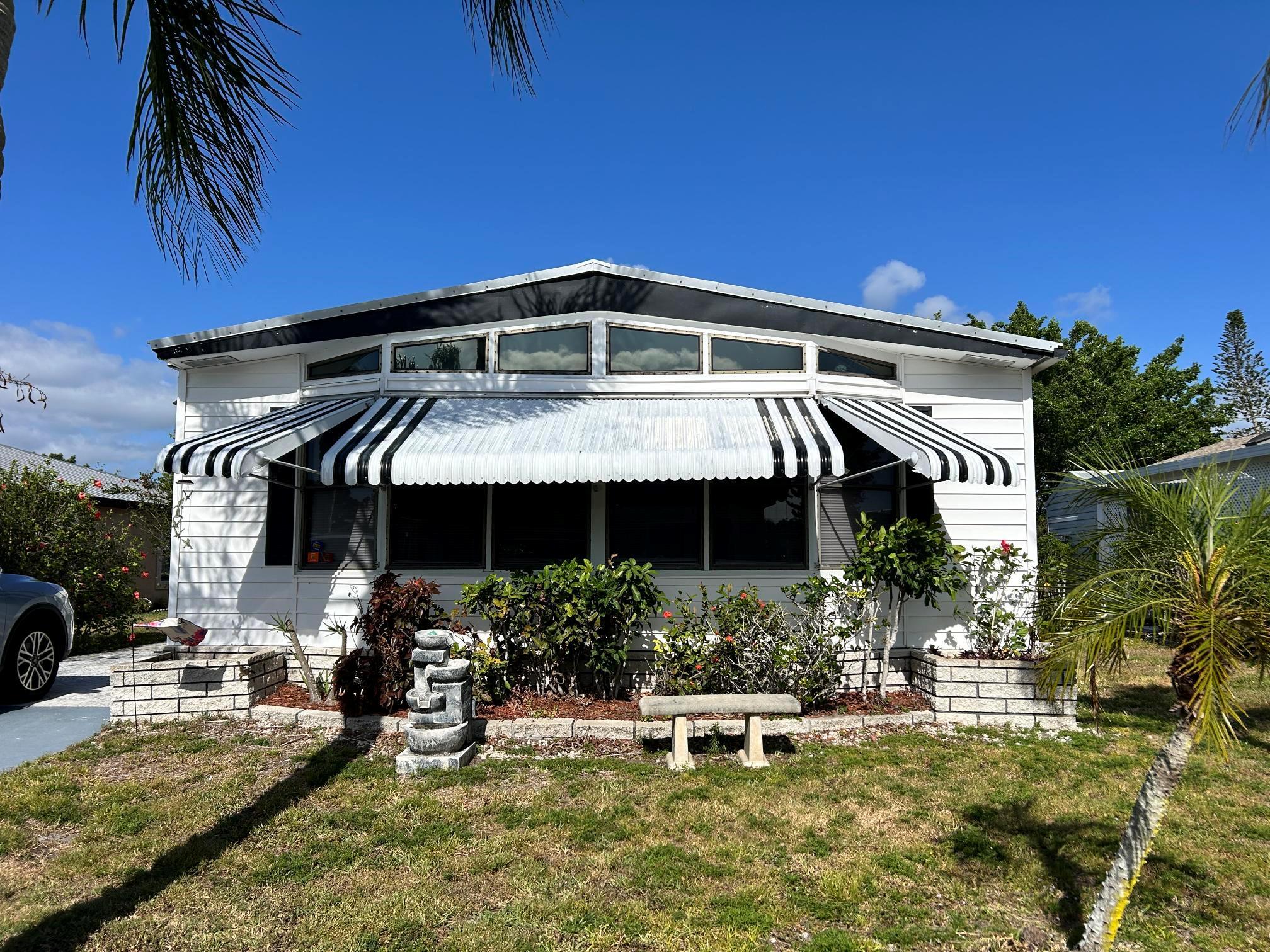 BRING ALL OFFERS! MOTIVATED SELLERS! Turn-Key 2 Bed | 2 Bath Manufactured Home - Fully Furnished! Move right into this beautifully maintained 2 bedrooms, 2 bath manufactured home, perfectly set up for easy Florida living! This turn-key home is fully furnished and features laminate flooring throughout, making it both stylish and low-maintenance. Key Features: Spacious Island Kitchen with plenty of prep space and cabinetry, Comfortable Florida Room great for relaxing or entertaining, Newer Metal Roof for peace of mind and long-lasting durability, Generous storage options both inside and out, Bright, open layout with tasteful furnishings include, This is the perfect home for full-time residents, or anyone looking for an affordable, move-in-ready home in a welcoming community.