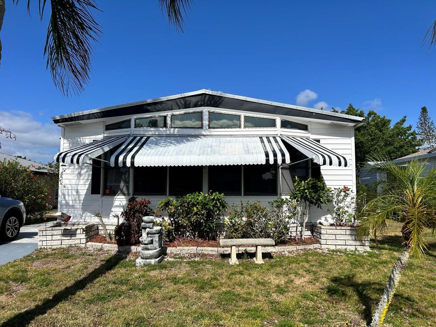PET SECTION! BRING ALL OFFERS! MOTIVATED SELLERS! Turn-Key 2 Bed | 2 Bath Manufactured Home - Fully Furnished! Move right into this beautifully maintained 2 bedrooms, 2 bath manufactured home, perfectly set up for easy Florida living! This turn-key home is fully furnished and features laminate flooring throughout, making it both stylish and low-maintenance. Key Features: Spacious Island Kitchen with plenty of prep space and cabinetry, Comfortable Florida Room great for relaxing or entertaining, Newer Metal Roof for peace of mind and long-lasting durability, Generous storage options both inside and out, Bright, open layout with tasteful furnishings include, This is the perfect home for full-time residents, or anyone looking for an affordable, move-in-ready home in a welcoming community.