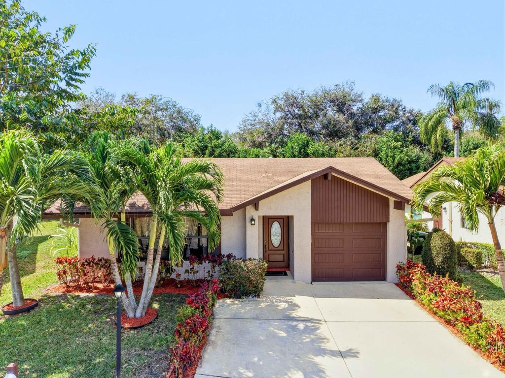 Photo of 6345 Tall Cypress Circle, Greenacres, FL 33463 (MLS # B26025225)