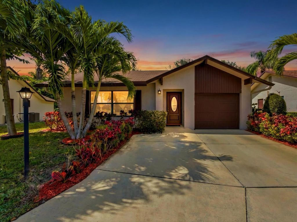Photo of 6345 Tall Cypress Circle, Greenacres, FL 33463 (MLS # B26025225)