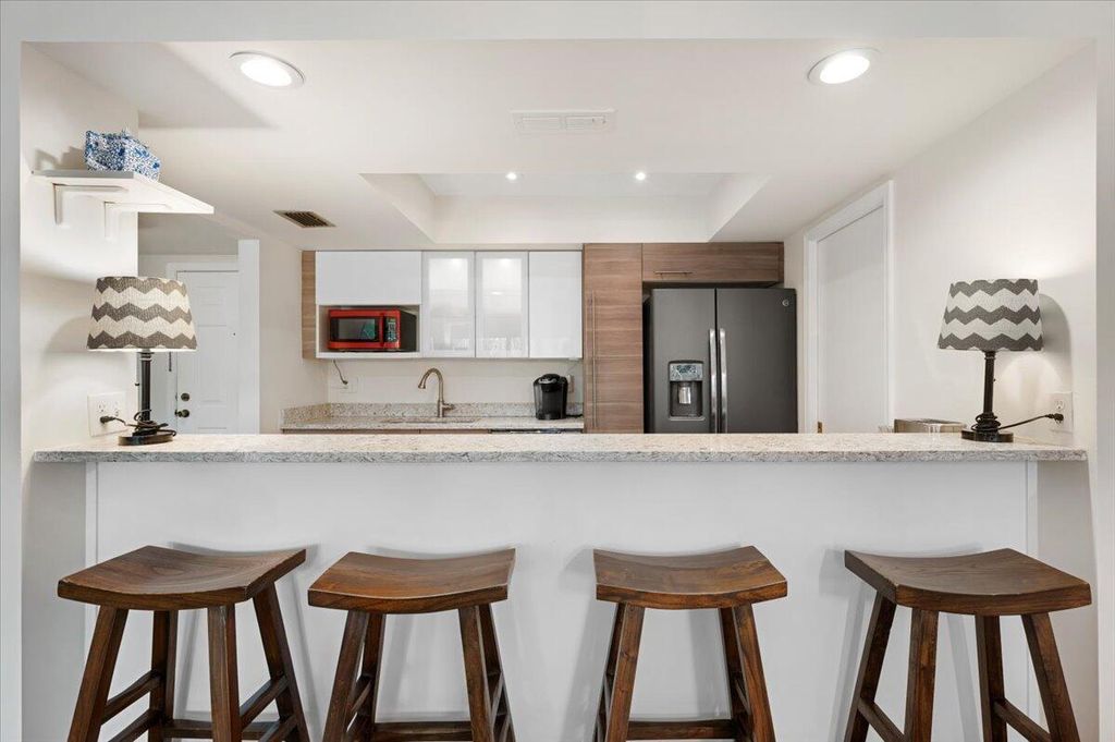 Photo of 11863 Wimbledon Circle #525, Wellington, FL 33414 (MLS # B26014350)