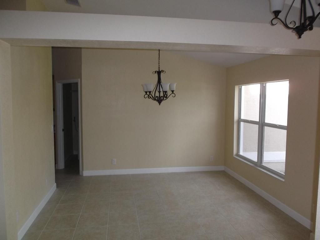 Photo of 319 SW Fig Avenue, Port Saint Lucie, FL 34953 (MLS # R10949788)