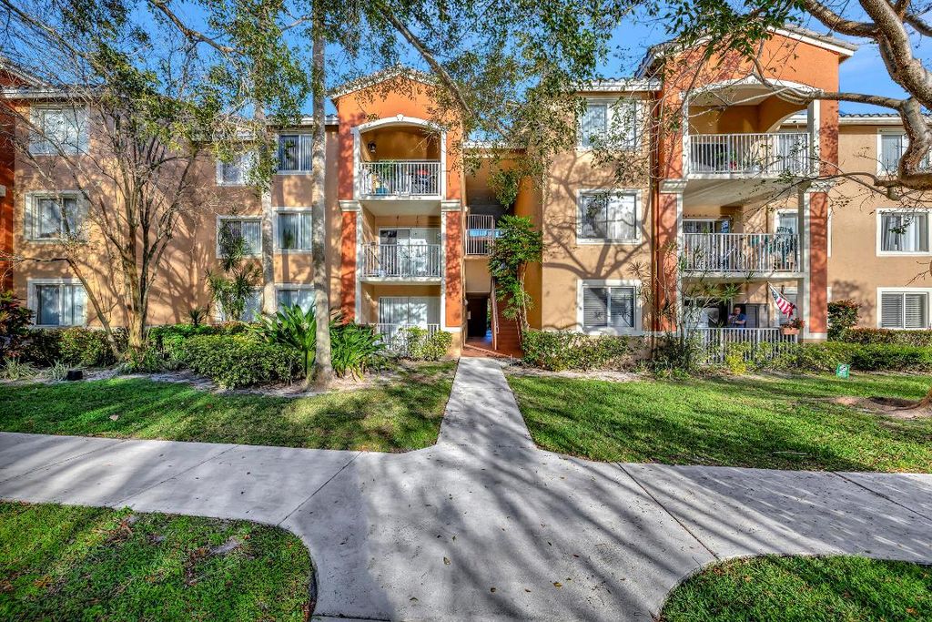 Photo of 3854 Lyons Road #203-5, Coconut Creek, FL 33073 (MLS # R10964049)