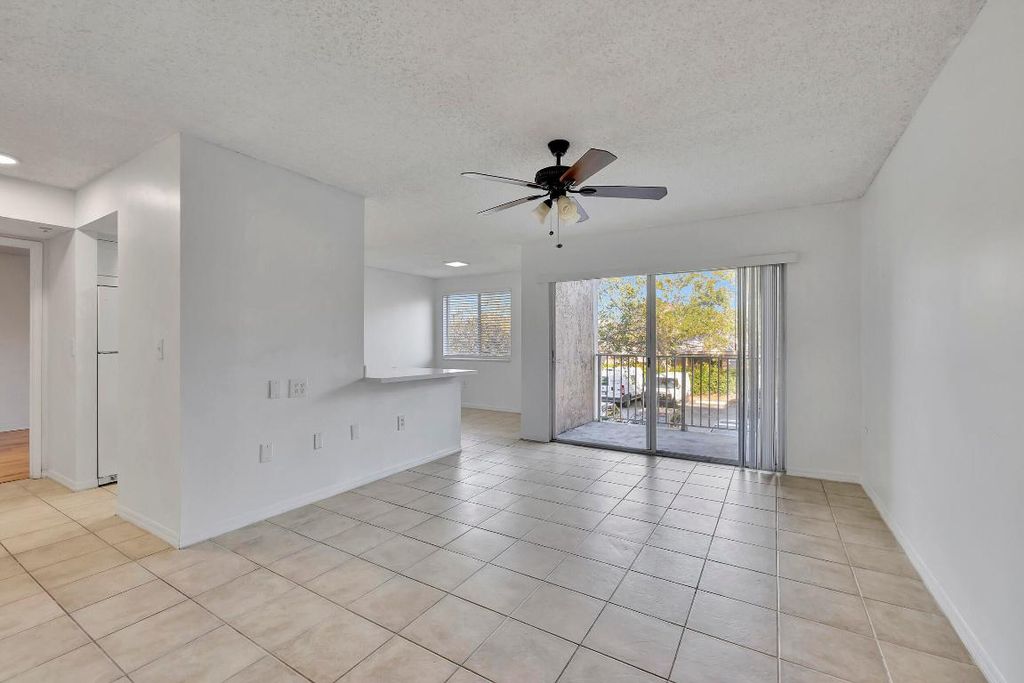 Photo of 3854 Lyons Road #203-5, Coconut Creek, FL 33073 (MLS # R10964049)