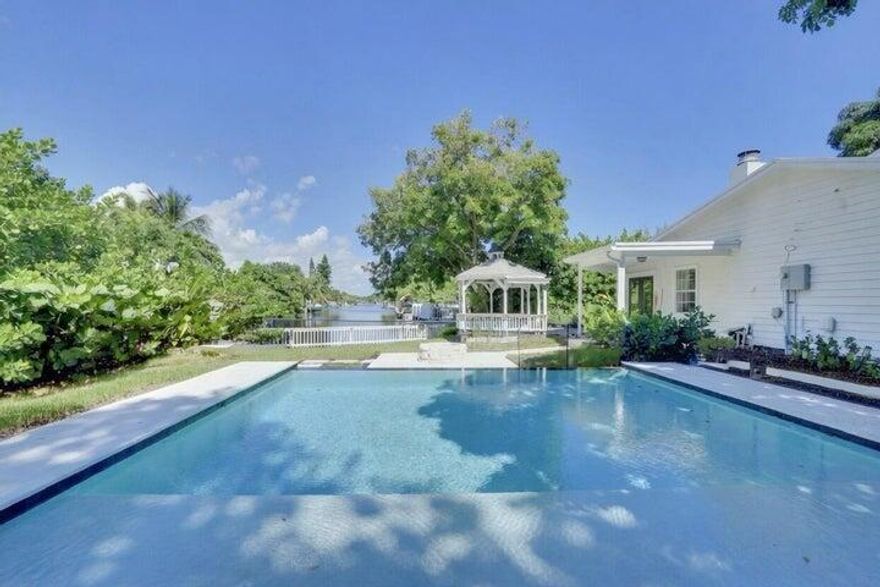 Experience the perfect blend of luxury and lifestyle in this stunning waterfront home, ideally situated on a desirable corner lot. Boasting 4 spacious bedrooms and 2.5 baths, this residence offers both comfort and functionality for everyday living and entertaining. Step outside to your private oasis featuring a beautifully designed pool, where tranquil water views create the ultimate backdrop for relaxation or hosting guests. Inside, the home is filled with natural light and thoughtfully designed living spaces that flow seamlessly from room to room. With its prime location, generous layout, and resort-style outdoor living, this property delivers the best of waterfront living with space, style, and serenity.
