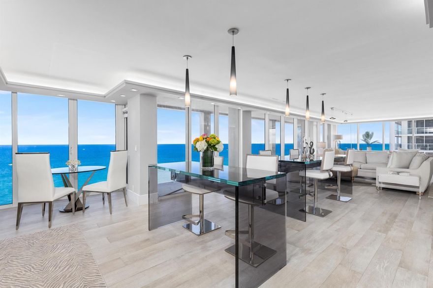 Experience the pinnacle of coastal elegance at 2800 South Ocean Boulevard, Residence 18F. This distinguished southeast corner residence, perched high above, offers sweeping panoramic ocean views. Encompassing approximately 2,150 square feet, this meticulously renovated 3-bedroom, 2.5-bathroom home features an expansive oceanfront wrap-around balcony, complemented by an additional covered balcony off the west-facing primary bedroom--perfect for savoring both sunrise and sunset in sublime comfort.Crafted with contemporary refinement and practical sophistication, the open-concept kitchen and living areas harmoniously blend, creating an ideal setting for both intimate gatherings and grand entertaining.