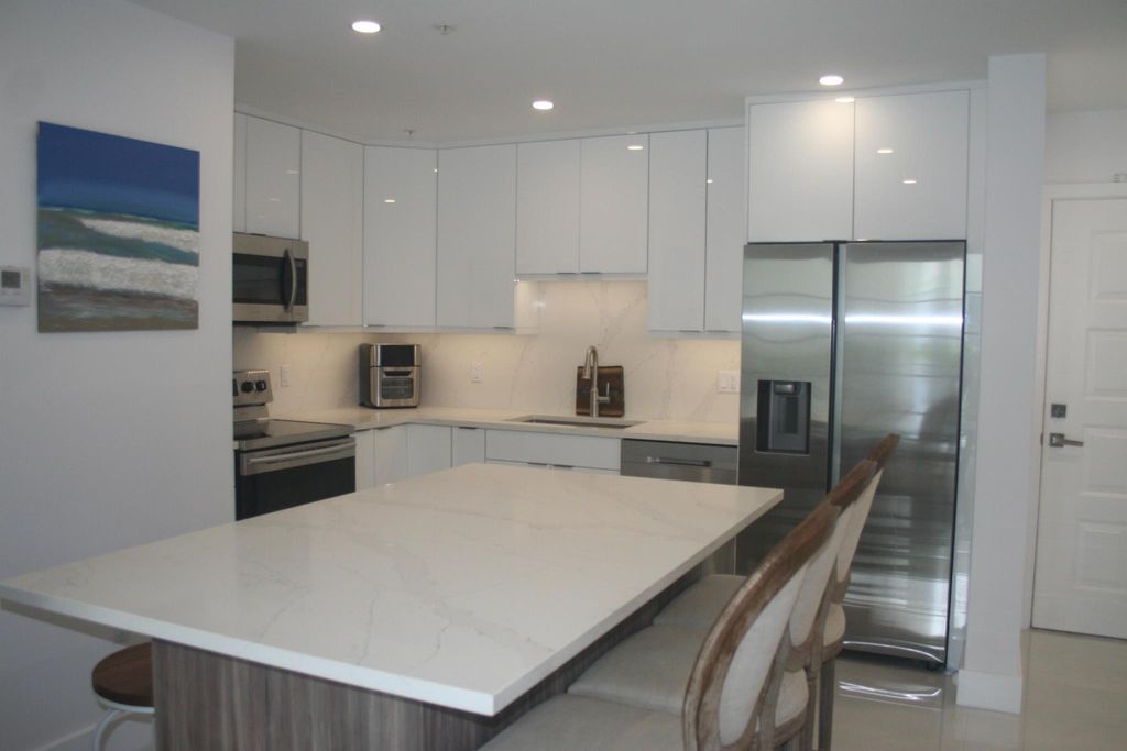 Photo of 1203 Town Center Drive #416, Jupiter, FL 33458 (MLS # R10983389)