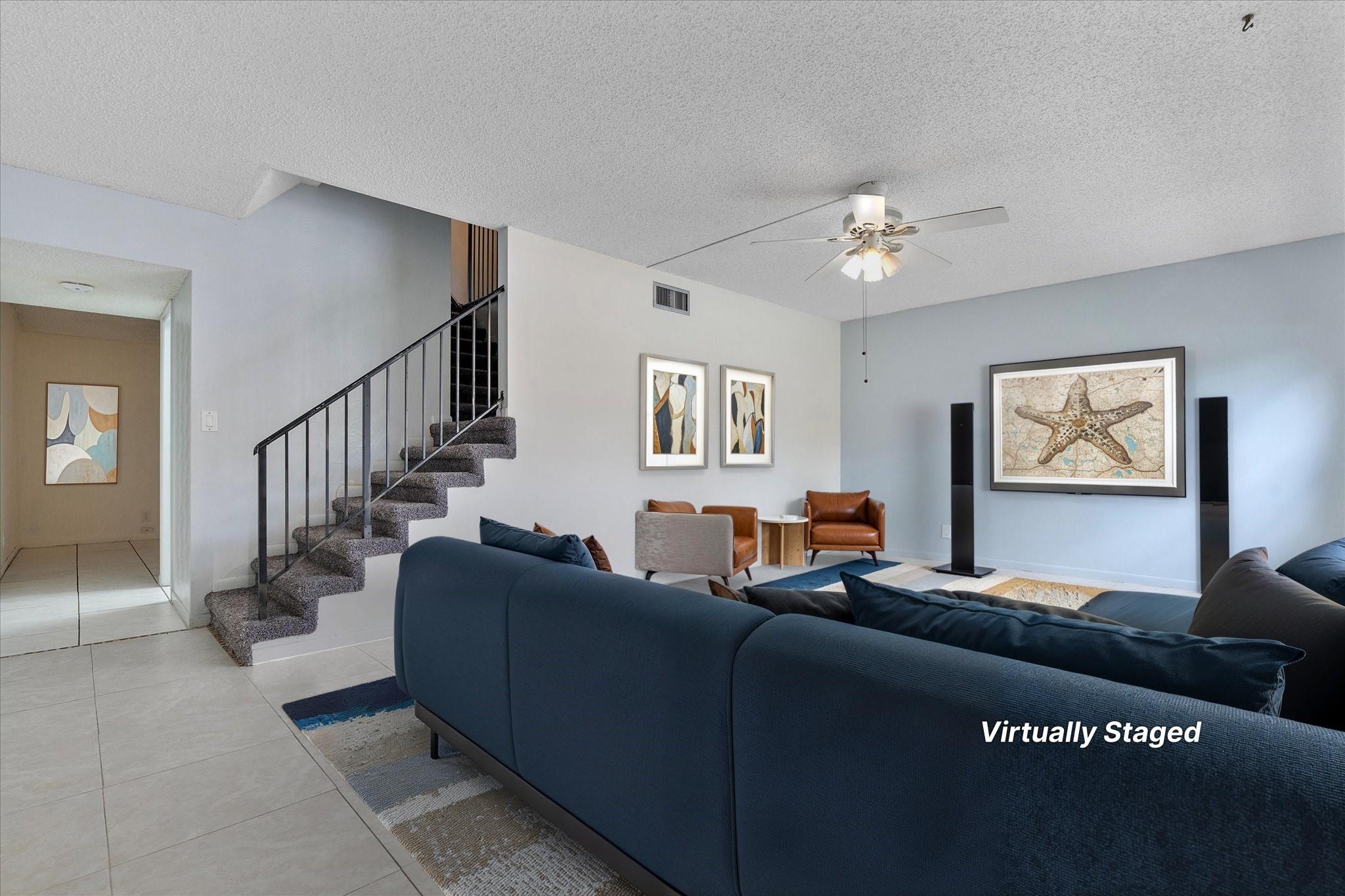 Beautifully updated 2-story townhouse in the desirable community of Valencia Village in Davie. Features include tile floors on the main level, wood in bedrooms, and new carpet on stairs. The open living area flows to a covered patio and private backyard. Upstairs offers 3 bedrooms, 2 baths, and large closets, with a half bath and laundry on the main floor. Recent upgrades include new water heater, whole-house water filtration, repainted interior, updated electrical, renovated bathrooms, updated kitchen cabinets, stainless steel appliances, and hurricane impact windows, doors, and sliders. Community amenities include pools, clubhouse, tennis, and lush green spaces. Conveniently close to shopping, dining, universities, and major highways.