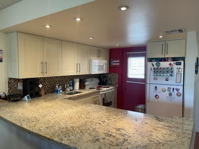 INCREDIBLE LAKE VIEWS FROM THIS UPDATED CORNER UNIT! REMODELED KITCHEN AND BATHS. LAMINATE WOOD FLOORS THROUGHOUT, NO CARPET! SCREENED BALCONY! UP TO TWO PETS ALLOWED (MAX WEIGHT 40LBS FOR ONE DOG OR TOTAL COMBINED WEIGHT OF 40LBS FOR TWO DOGS). NO W/D IN UNIT (COMMUNITY LAUNDRY JUST A FEW STEPS AWAY). ASSOCIATION REQUIRES A 670 OR BETTER CREDIT SCORE FOR ANYONE OVER THE AGE OF 18 LIVING IN THE CONDO.