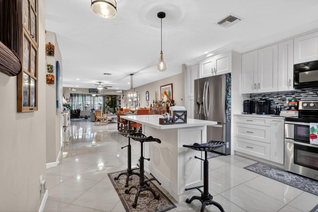 Photo of 5780 Fernley Dr #W113, West Palm Beach, FL 33415 (MLS # B26000341)