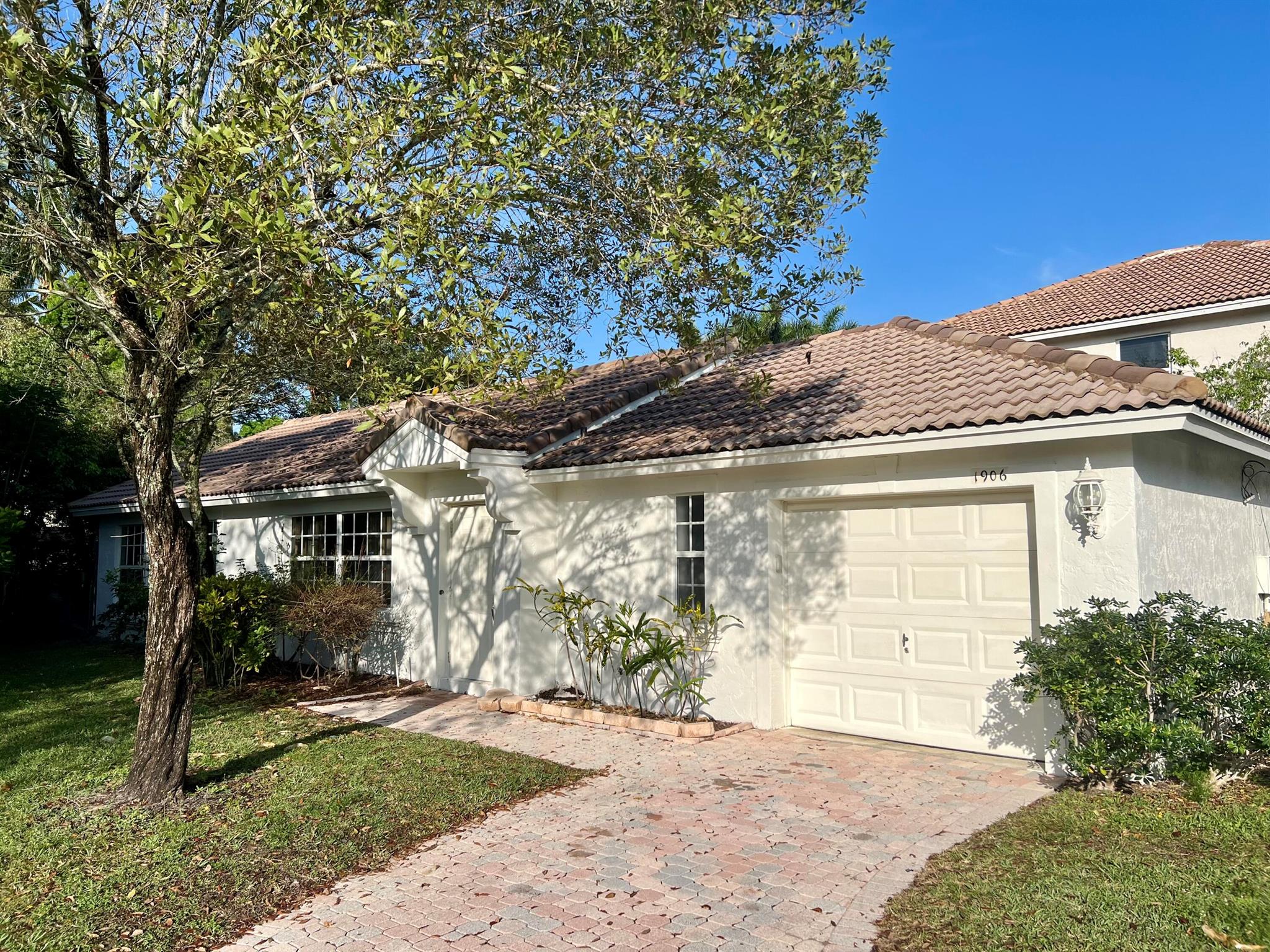 Beautiful 2-bedroom, 2-bathroom residence nestled in the vibrant community of Wellington, renowned for its top-rated schools. Take advantage of this opportune moment to secure a spot in the sought-after school district before the seasonal enrollment rush begins. The expansive yard offers ample space for potential additions like a refreshing pool or a delightful playground for children. Meticulously maintained by its current owners, this home boasts a newer air conditioning system and upgraded stainless steel appliances. Freshly painted interior and new wood laminate flooring installed in both bedrooms! Experience the allure of abundant natural light illuminating the interiors, inviting you to bask in the warmth of South Florida's sunshine. ***PET FRIENDLY***