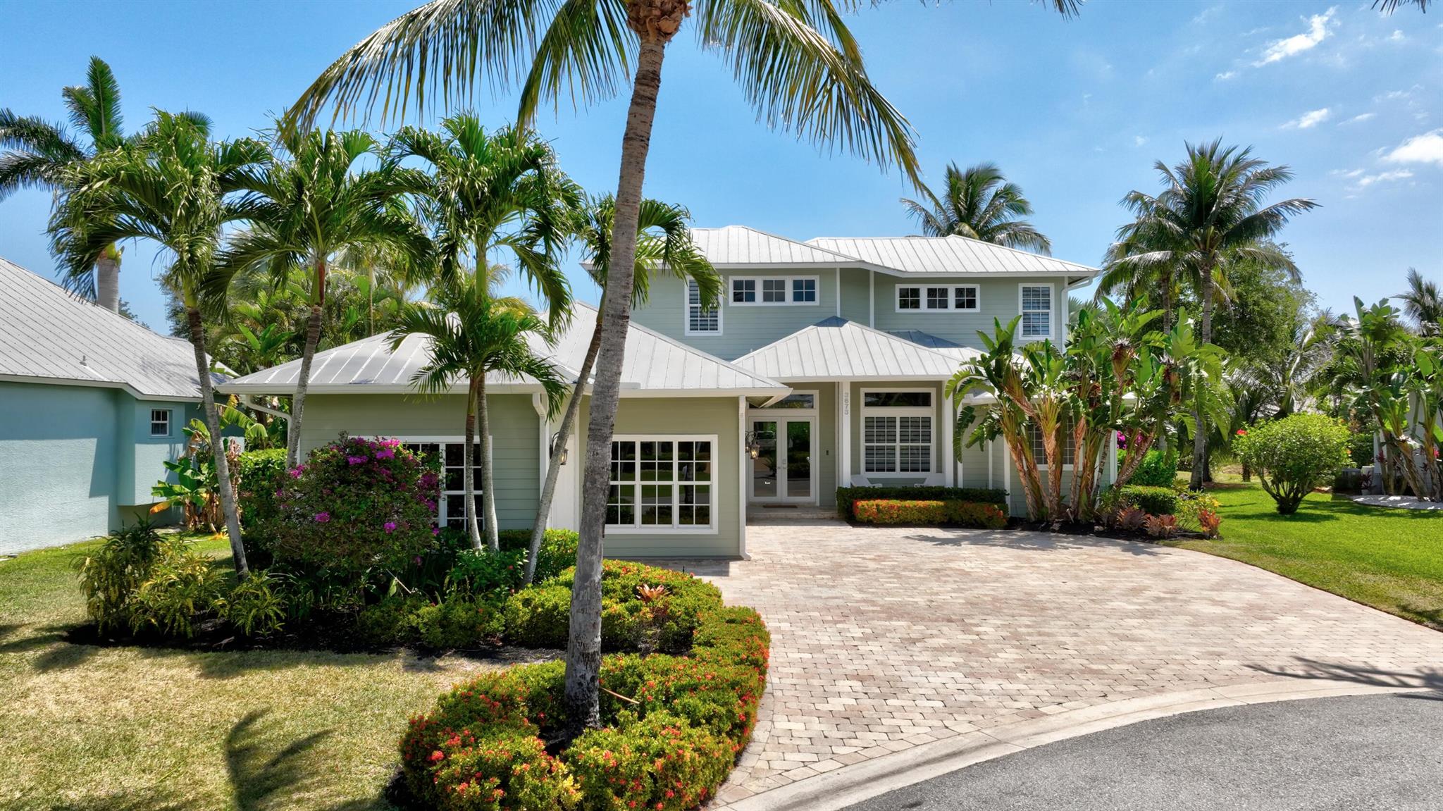 Welcome to The Reef! A gated community inside of Rocky Point. This beautiful Key West 2 story home is located on a quiet cul de sac & features 4 Bedrooms, Loft/Game Room, Office, 3 Full Baths, & 2 Half Baths, Living Room, Family Room, Dining Room, Breakfast Nook, and Laundry/Mud Room. Master Bdrm, Guest Bdrm 1, & Office are located on the 1st floor. 2 Guest Bdrms & Loft on the 2nd floor. This home has many recent upgrades - Large 30x60 porcelain tile in the main areas on the 1st floor. Luxury Vinyl in the bdrms and main areas upstairs. Glass shower enclosures in the bathrooms. Double ovens & appliances have been recently upgraded. All windows & doors are Hurricane Impact. Outdoor features include a pool, shower & cabana bath surround by lush tropical landscaping creating a private oasis,