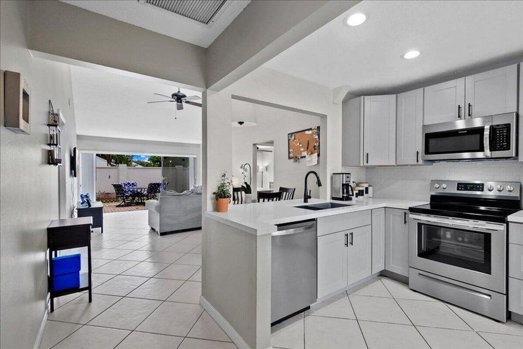 Photo of 12875 Spinnaker Lane, Wellington, FL 33414 (MLS # B26027317)