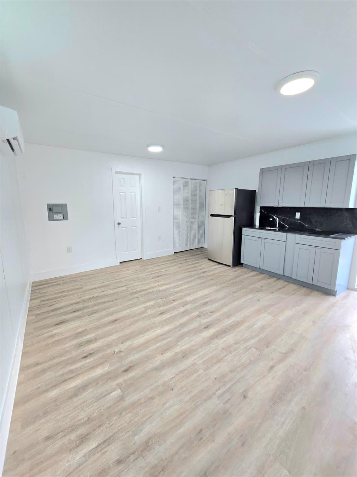 Remodeled Efficiency - All Utilities Included!Private entrance.Cozy, newly remodeled efficiency, perfect for 1-2 people. Includes water & electricity. Features a small kitchen, refrigerator, private bathroom, and open living space.Requirements: clean background, credit report, and proof of income. No smoking.