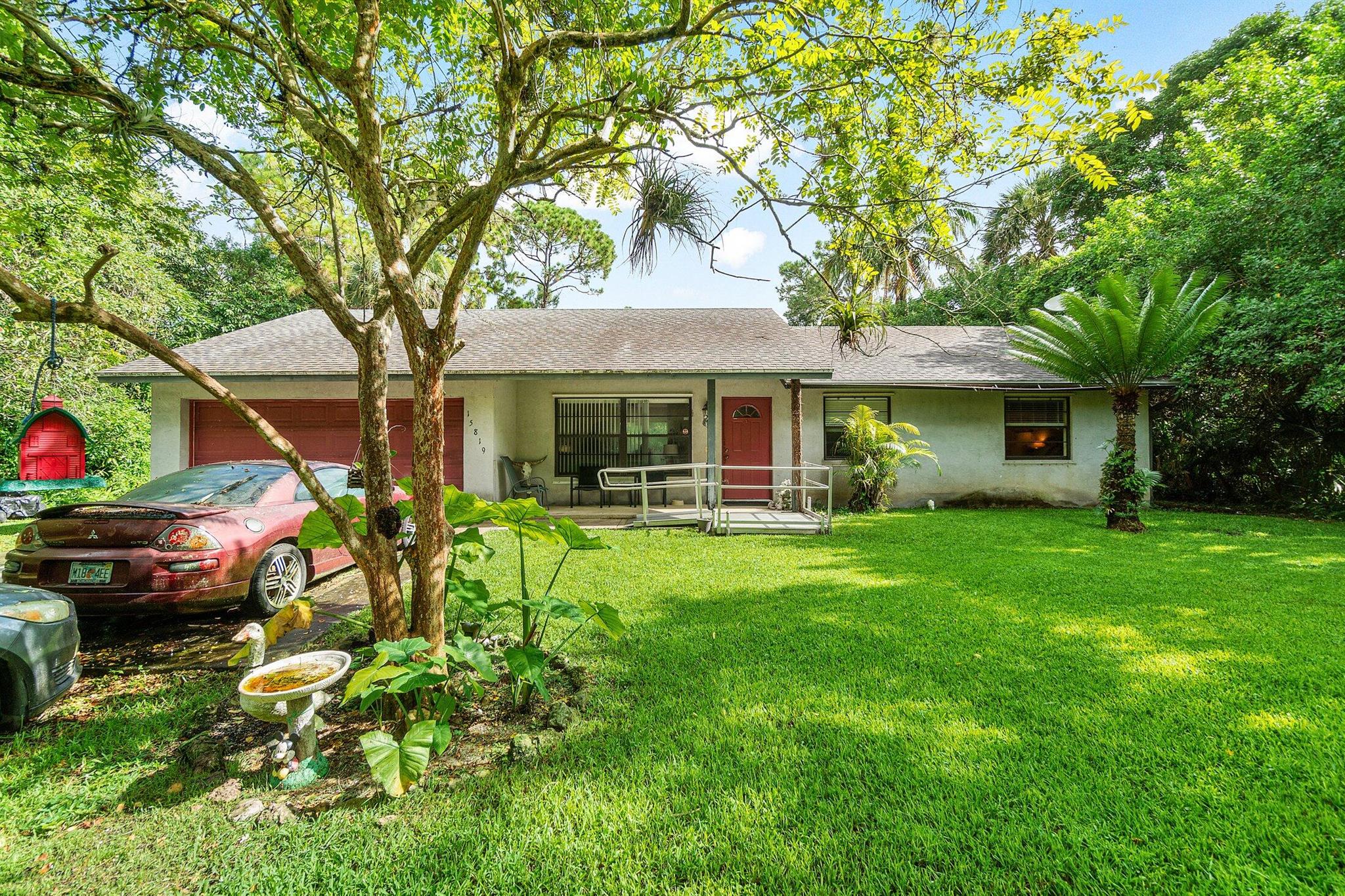 If you're looking for a fantastic ranch style home, look no further than this charming Acreage home. This beautiful 3 bedroom 2 bath ranch home features, beautiful LVP floors, new AC, but best of all the 2.16 acre street to street lot. This ranch home is a blank page ready for your own spin. The home is also located right across the street from J.W. Corbett Area which is a protected management area and will never be developed. This home is not only a must see but a great opportunity