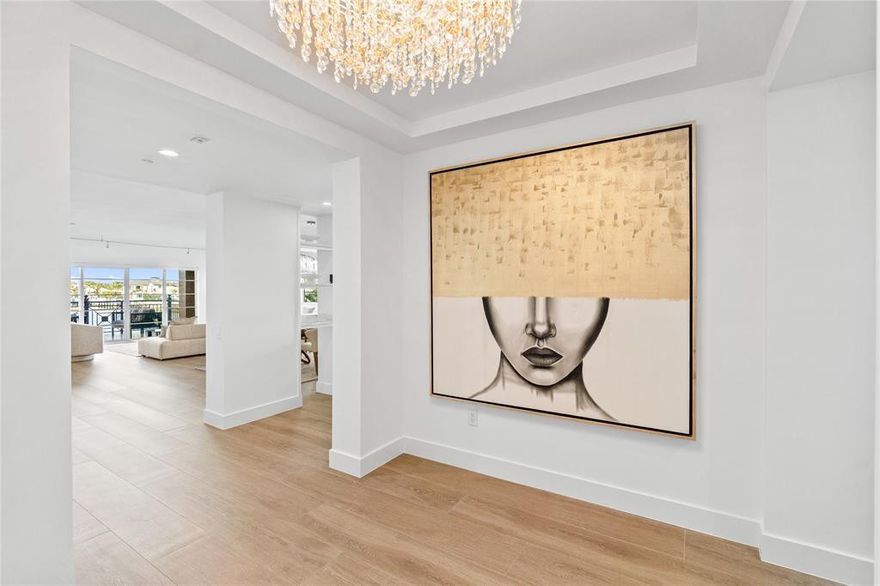 Experience elevated waterfront living in this Intracoastal-front residence within the boutique Mediterranea community. A new standard of waterfront architecture, this move-in-ready home features a private elevator entrance and modern interior designed for both style & comfort. Porcelain floors extend throughout the entire home. Impact windows & doors, built-in walk-in closets, and refined finishes are found throughout. The primary suite enjoys direct water views, complemented by two generous balconies ideal for sunset enjoyment. Additional highlights include two assigned garage parking spaces, a private storage room, pet-friendly living, and private deeded beach access—offering a rare blend of Intracoastal & beachside lifestyle.