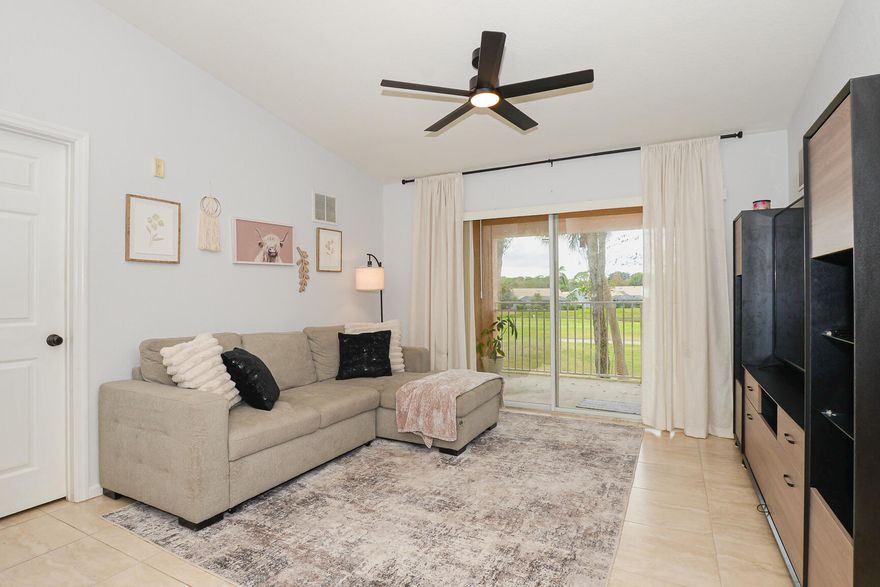 Corner unit on the second floor overlooking the golf course and lake, offering a super relaxing and quiet atmosphere. The condo features new tile throughout, fresh paint, and a completely updated kitchen with brand-new cabinets featuring soft-close drawers, modern matte black hardware and faucet, and gorgeous new quartz countertops. Vaulted ceilings add to the open feel, a benefit of being on the second floor. The west-facing balcony provides stunning sunset views every evening. Conveniently located just minutes from shopping centers and dining options. Condo amenities include a pool, tennis court, gym, and playground. Water heater and air conditioning were replaced in 2019.