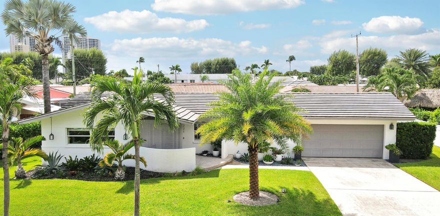 If you crave charm & elegance, blended with style and functionality, your search is over; 1221 Morse Blvd. in Yacht Harbor Manor welcomes you. This single-family island residence is a concrete block structure with impact windows and a concrete tile roof; THIS HOUSE IS A FORTRESS. With just one level, getting around is easy. Sit on the front porch swing and connect with nature or relax out back in your very own private oasis, the large pool deck is eager to entertain, just imagine Sunday BBQs with family and friends. The pool? Cannon balls are mandatory! The two-car garage is spacious, and if all this is not enough, this home is just a short walk to the blue waters off Singer Island's​​‌​​​​‌​‌​​​‌‌​​​‌‌‌​​‌​​‌‌​​​​ coast.