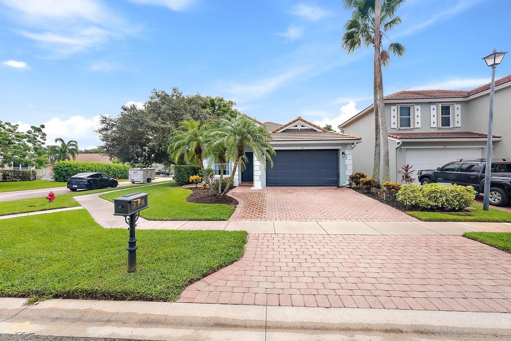 Photo of 715 Belle Grove Lane, Royal Palm Beach, FL 33411 (MLS # R11115013)