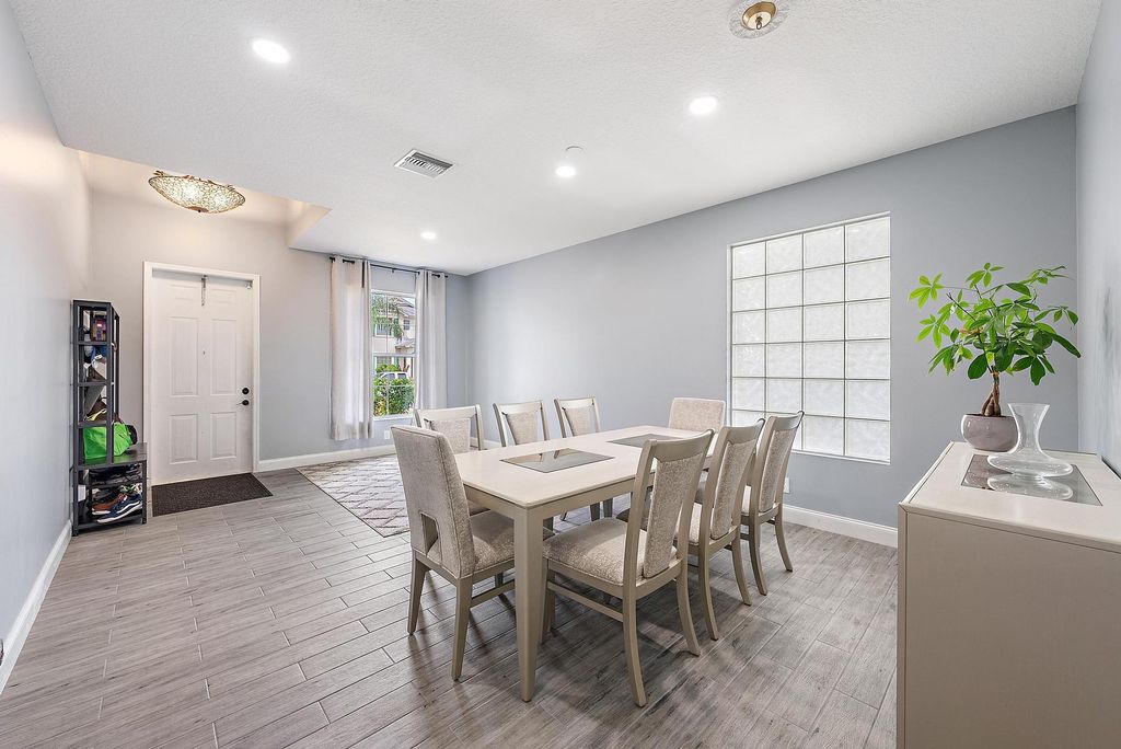 Photo of 715 Belle Grove Lane, Royal Palm Beach, FL 33411 (MLS # R11115013)