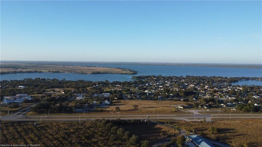 Over 10 acres of prime US Highway 27 frontage. Three existing buildings w/ total of 7874 sq ft, built as model homes for neighboring gated community, previously used as medical offices and maintained in good, clean condition, with 40 paved parking spaces as currently configured.  Upscale, gated Tomoka Heights community adjacent to the north and west. 1/5 mile highway frontage, opposite the expected Amazon Fulfillment Center. Dedicated highway crossover with deceleration lanes in both directions. Existing R3 zoning permits - among many other uses - medical and professional offices, single and multi-family housing, apartments, condos, hotels/motels and assisted living/nursing care. Seven additional acres zoned B3 available directly across the highway.
