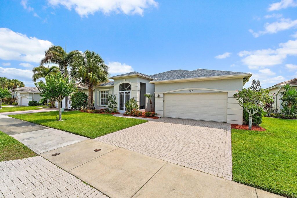 Photo of 317 SW Lake Forest Way, Port Saint Lucie, FL 34986 (MLS # B26031385)