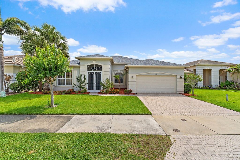 Photo of 317 SW Lake Forest Way, Port Saint Lucie, FL 34986 (MLS # B26031385)