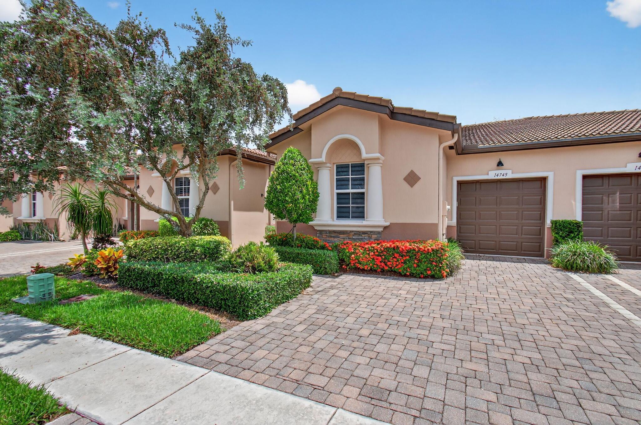 Experience a tasteful blend of comfort and elegance at the 14745 Via Porta property located in the esteemed Villaggio Reserve community in Delray Beach, FL. This well-maintained unit boasts of superior workmanship and attention to quality.As you approach the property, notice the architectural excellence reflecting traditional Floridian design. Its handsome exterior detailed with quality materials, exudes a charm that adds to the grace of the neighborhood. A neatly paved walkway leads to the main entrance, welcoming you into a world of cozy comfort.