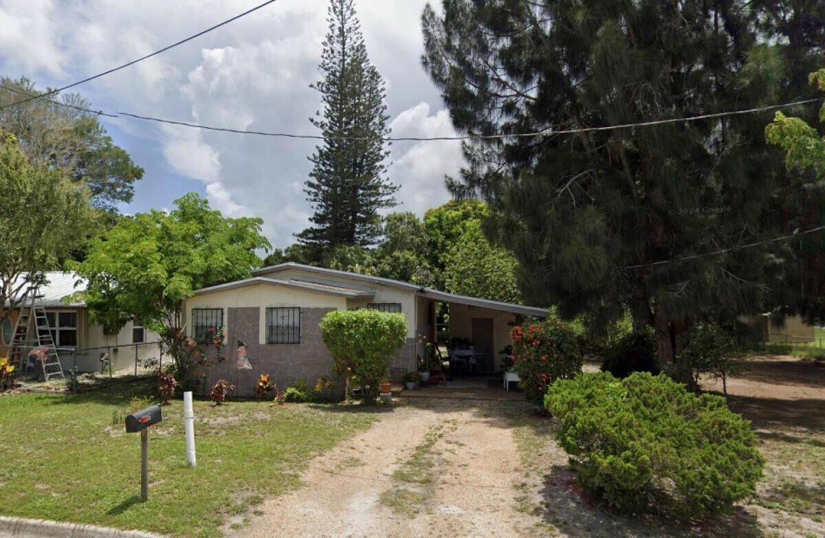 Home is on a big lot with the potential to build a new home next to the existing one.