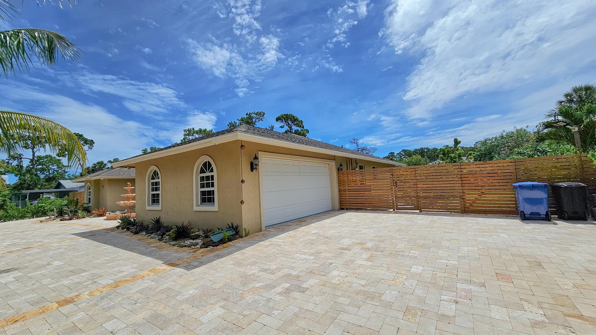 Single Family House in Palm Beach County with Fruit Trees, 4 Bedrooms, 2 Bathrooms, Open Concept, and Huge Backyard This beautiful single family house is located in Palm Beach County, and is situated on a large lot with a variety of fruit trees. The house has 4 bedrooms and 2 bathrooms, and an open concept floor plan that is perfect for entertaining guests. The spacious living room features soaring ceilings and large windows that let in plenty of natural light. The living room opens up to the dining room and kitchen, creating a seamless flow for entertaining. The kitchen features stainless steel appliances and granite countertops.