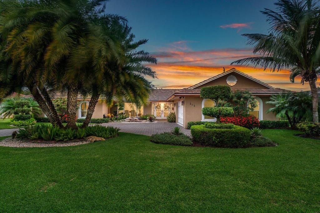 Photo of 212 Gleneagles Drive, Atlantis, FL 33462 (MLS # R10878132)