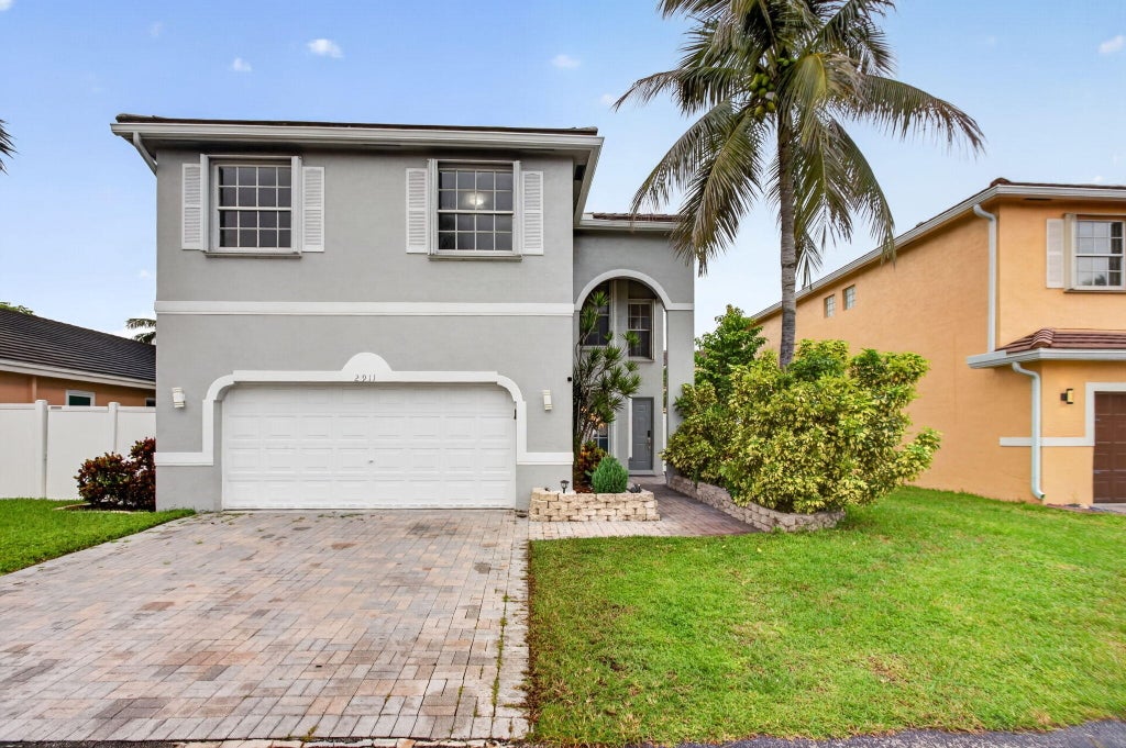 Photo of 2911 E SABLE Circle, Margate, FL 33063 (MLS # B26084030)