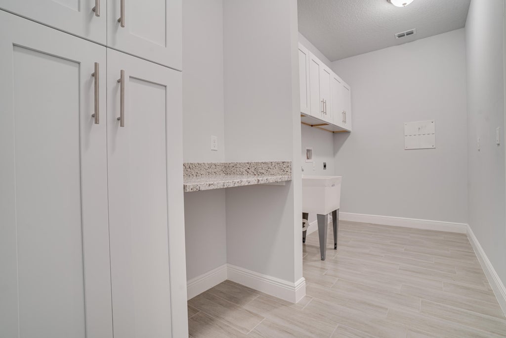 Photo of 4502 SW Wabash Street, Port Saint Lucie, FL 34953 (MLS # R10977153)