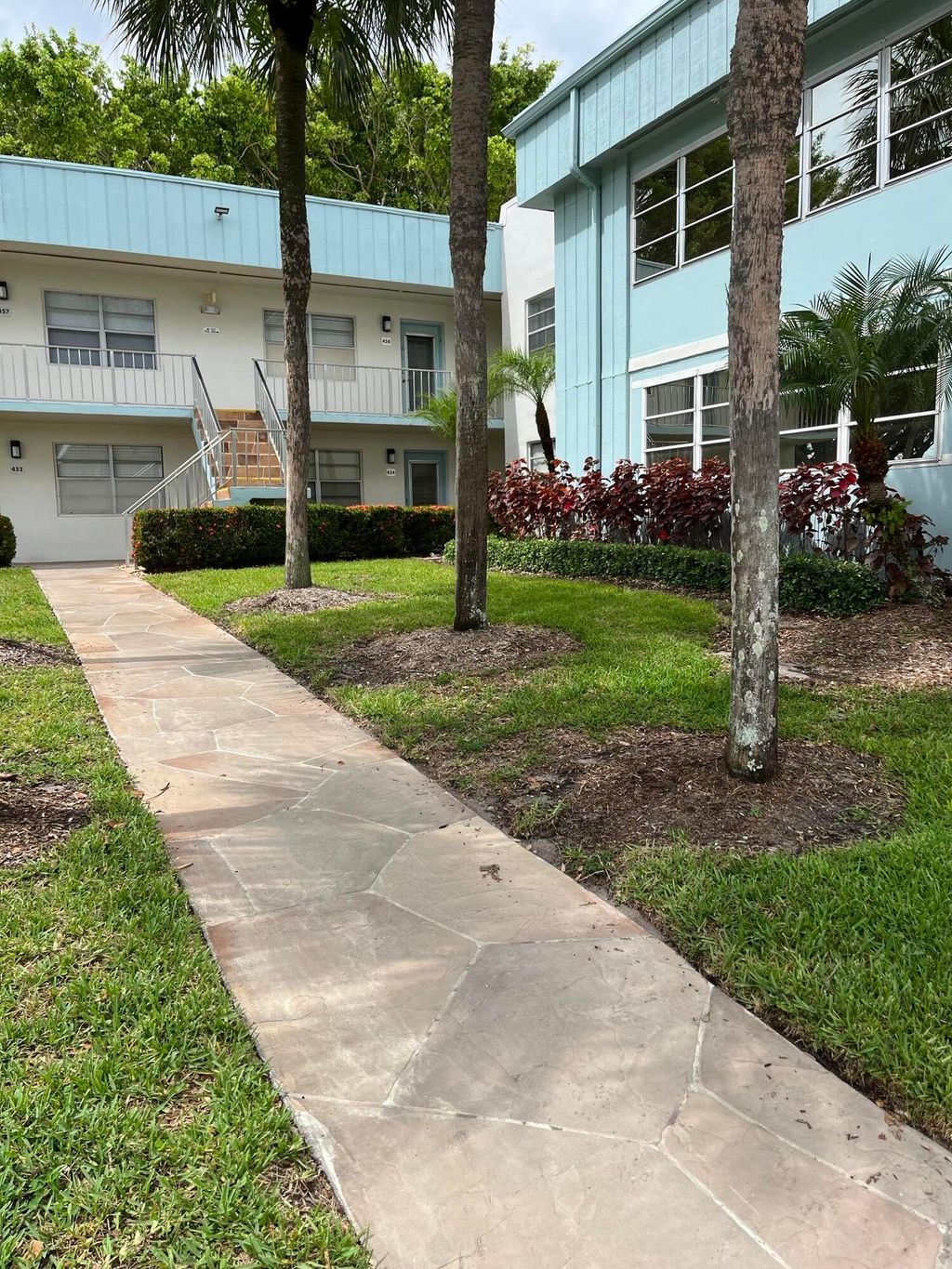 Photo of 434 Normandy Ln #E, Delray Beach, FL 33484 (MLS # B26035232)