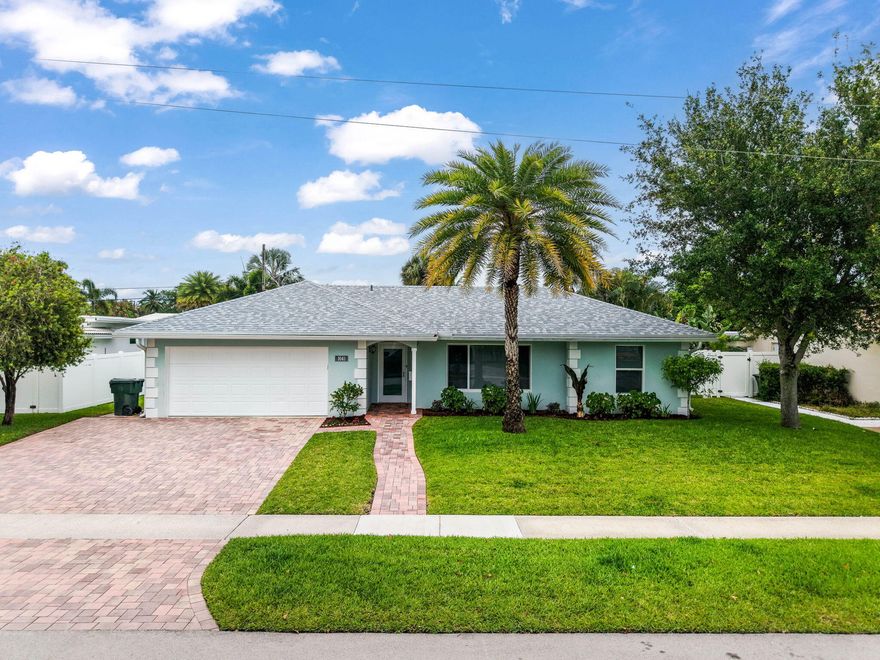 Stunning 4 bedroom, 2 bath one story home in coveted Boca Square in the heart of East Boca. Freshly painted and move in ready, this home features a split floorplan with living and family room spaces plus an updated, open kitchen with a huge island perfect for entertaining. Enjoy peace of mind with a brand new roof and all new impact windows throughout. The fully fenced backyard offers a beautiful pool and covered patio ideal for relaxing or hosting guests. Additional highlights include a 2 car garage and expanded driveway for extra parking, updated bathrooms and tile throughout. Located in the desirable Addison Mizner Elementary school zone and just minutes to the beach, downtown Boca, highways, shopping and dining. 2025 A/C and water heater.