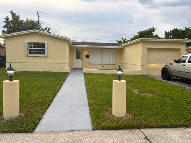 Photo of 3921 NW 35th Terrace, Lauderdale Lakes, FL 33309 (MLS # B26085149)