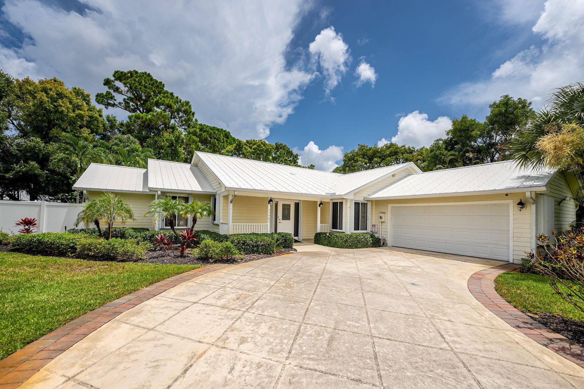 Waterfront, Ocean Access! Beautiful 3 Bed, 2.5 Bath, 2 Car Garage and over 2,200 SF of living space. You will love the updated quartz kitchen, white shaker-style cabinets and stainless appliances. Plenty of cabinet space, breakfast bar and quartz backsplash. Large family room w/fireplace, built-in shelves, and wood plank tile floors throughout the living area. Spacious, split floor plan and large master suite. The perfect home for entertaining featuring a huge Screened POOL, Porch and Patio. Plus a large wood deck and outdoor oasis that is great for weekend BBQ's or just relaxing. Private dock and boat lift w/ ocean access! Set on a very private, tropically landscaped & fenced HALF ACRE lot and storage shed. Plenty of room for boat, jet ski, etc.