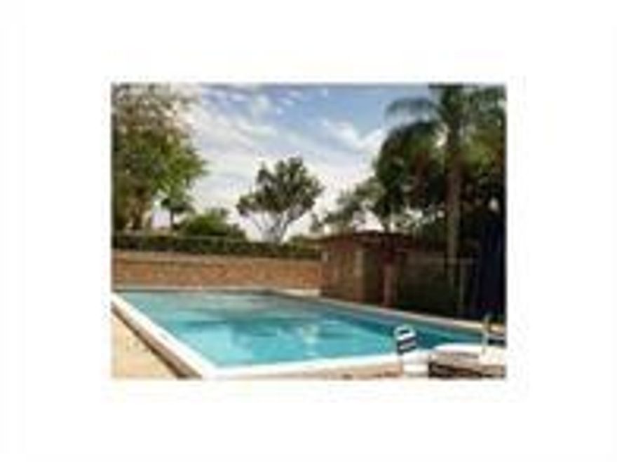 3/2 condo, pretty complex in central Coral Springs, community POOL. The unit has been COMPLETELY UPDATED with tile floors, new everything in the kitchen, and two new bathrooms. WASHER/DRYER in unit. Screened patio with storage closet and a backyard, to o!!! Convenient parking. Water included in rent.