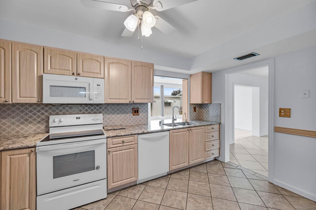 Photo of 221 NW 25 Court, Pompano Beach, FL 33064 (MLS # R10973947)