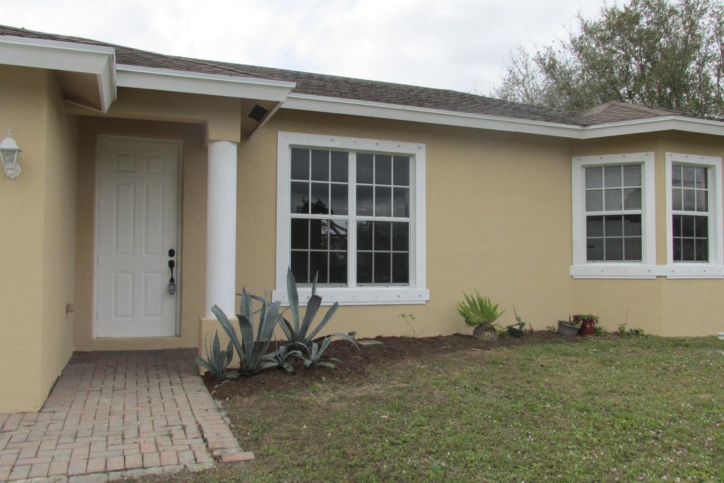 Photo of 2002 SW Trenton Lane, Port Saint Lucie, FL 34984 (MLS # R11064371)