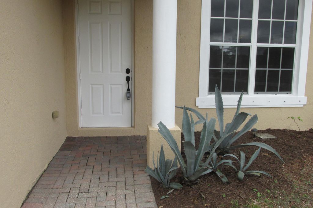 Photo of 2002 SW Trenton Lane, Port Saint Lucie, FL 34984 (MLS # R11064371)