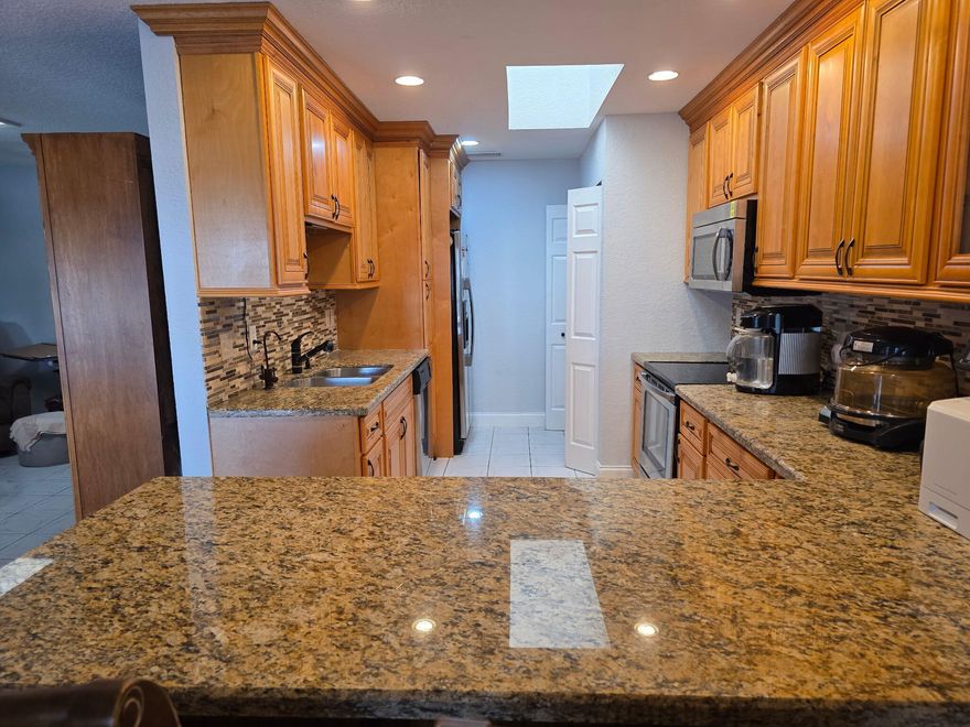 Stunning lake views beautifully updated villa w. 2 car driveway. Completely remodeled & ready for new owners. Granite countertops, stainless steel appliances, beautiful cabinetry,high hats, breakfast bar and desk area. New AC Unit & Water Heater (2026). No popcorn ceilings!!Light & bright w/ 2 sun lights Fully furnished - 2 flat screen tvs. Tile floors-no carpet.Glass front entryway, glass enclosed front patio w/ ac unit.Bathrooms have both been updated. Master bedroom sliders to enclosed patio with breathtaking lake view.. Master closet has safe & shelves.Decorative glass front front door. Sleep sofa in LR. F/S W/D. Clubhouse w/ pool, spa,tennis, basketball, & mini golf.  Centrally located near I-95, FL Turnpike, Shopping, Palm Beach Outlet Mall, Restaurants, Beaches & houses of worship Come enjoy the South Florida lifestyle in our new villa in Cypress Lakes. Property is sold "AS IS" with Right to Inspect. 
HOA fee includes yard care, basic cable, and internet. Buyer/agent to verify all info, .facts. Plat 3 HOA is amending docs to require background checks. Read Pet Restrictions. No rentals 2 years-thereafter 3 month minimum