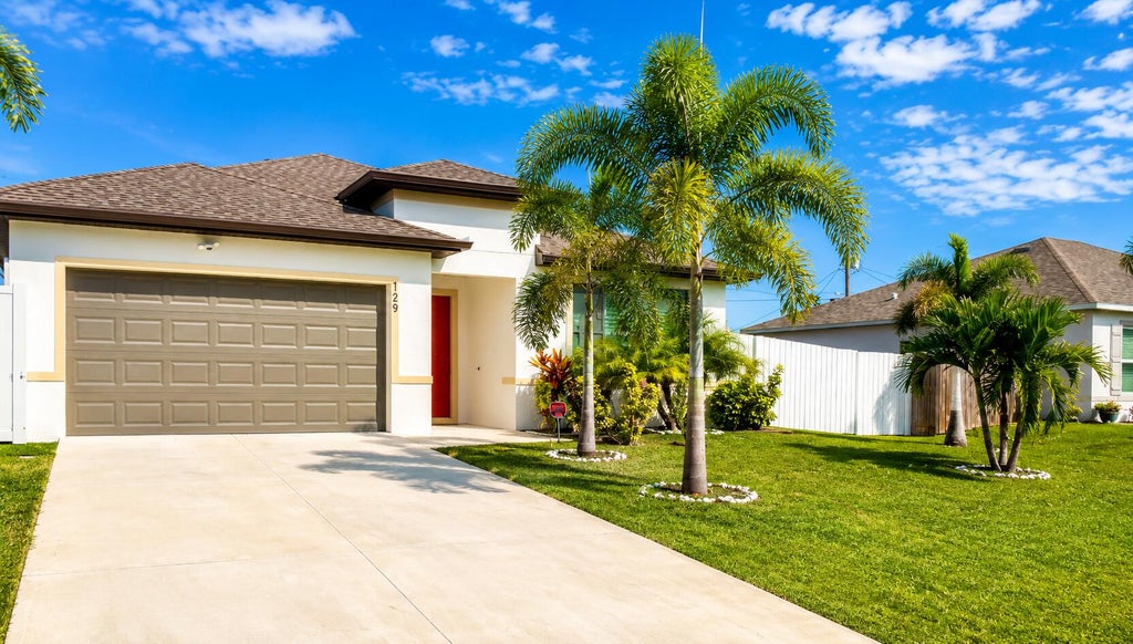 Photo of 729 SW Haas Avenue, Port Saint Lucie, FL 34953 (MLS # B26045568)
